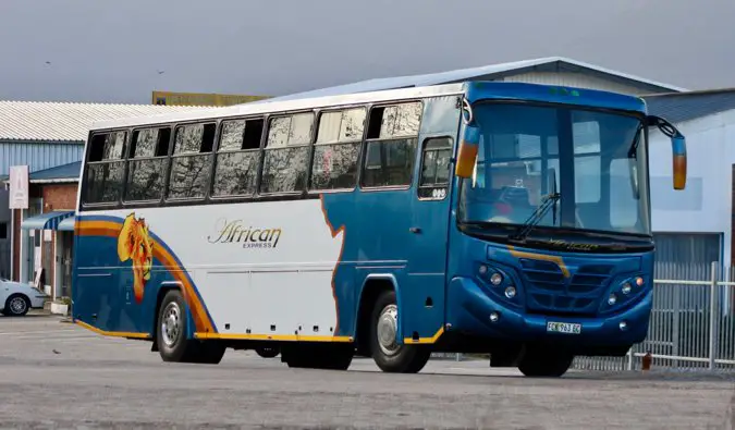 A large public bus on the road in Africa