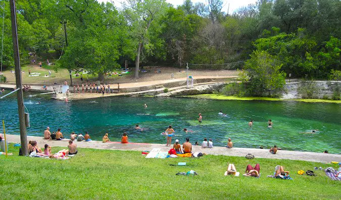 People relaxing at Barton Springs in Austin