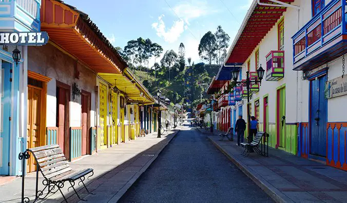 bright streets in Salento, Colombia with doors painted yellow, green, and blue