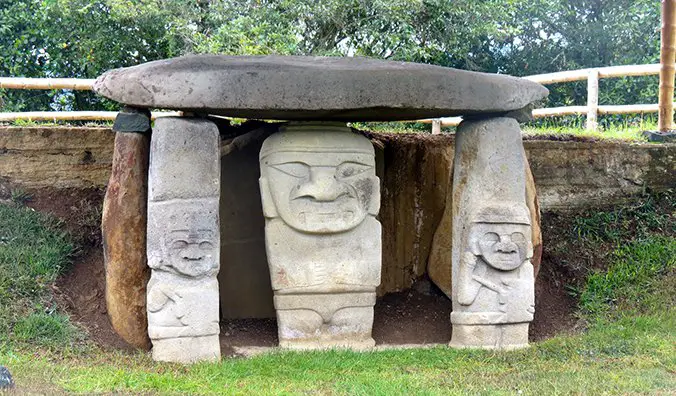 face carvings on a tomb in San Agustin Archaeological Park; photo by Erik Cleves Kristensen (flickr:@erikkristensen)