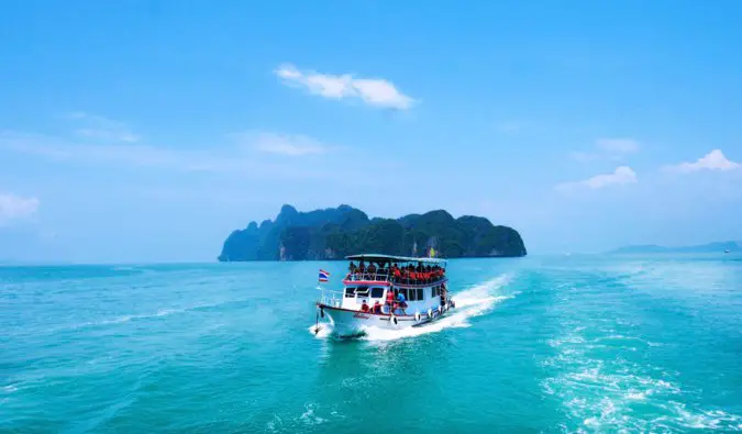 a ferry full of travelers in southeast asia