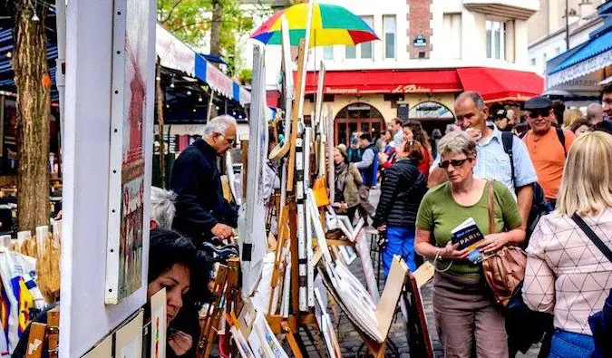 people browsing art in the montmartre district