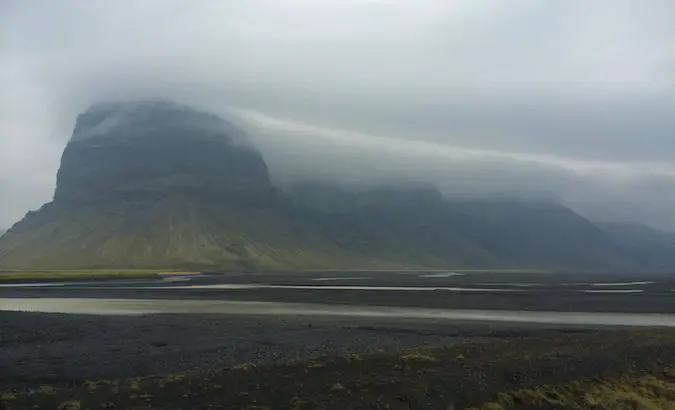 on a rainy day in southern Iceland, these gigantic mountains were covered in clouds