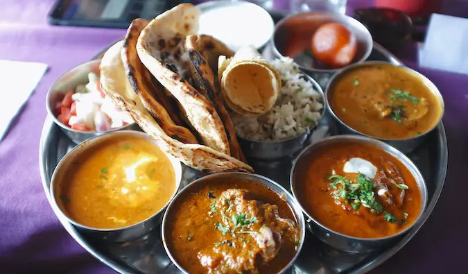 A food colorful platter of traditional thali food in India