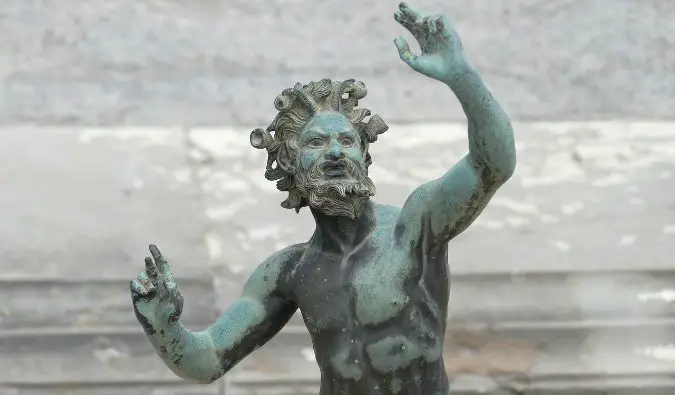 A statue outside of the biggest house in all of Pompeii, Italy