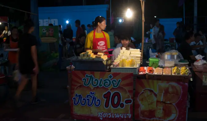 pad thai making street stall in the night market bangkok