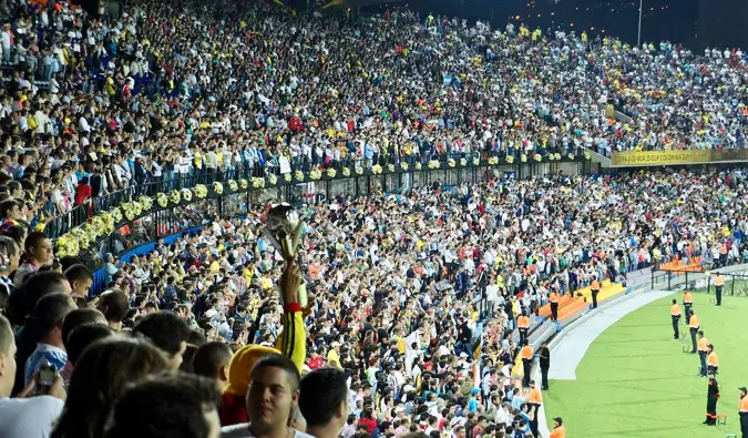 a packed stadium full of soccer fans in Medellin, Colombia