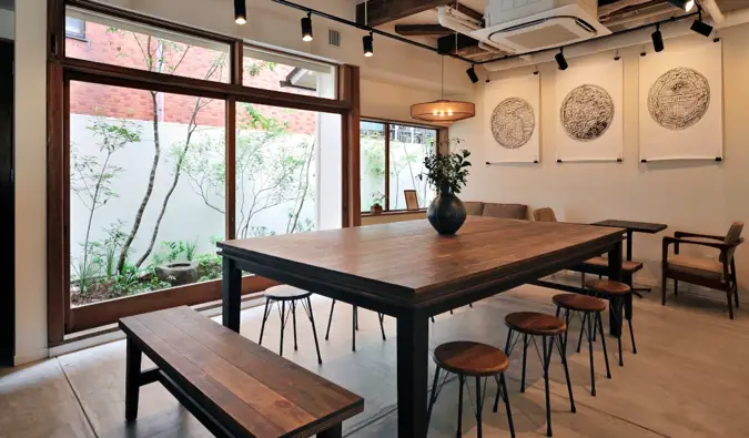 A large co-working table at Kaisu Hostel in Tokyo, Japan