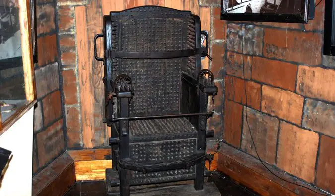 An old metal torture chair on display at the Torture Museum in Amsterdam
