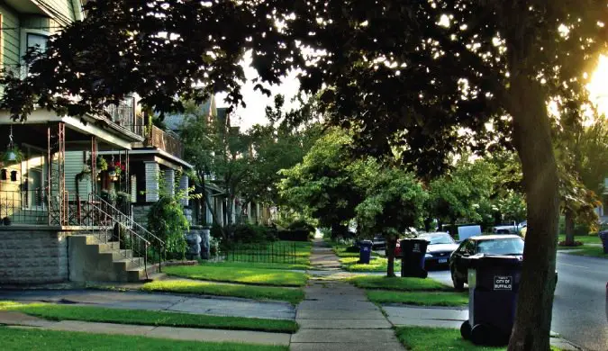 Home and cars in a suburban neighborhood